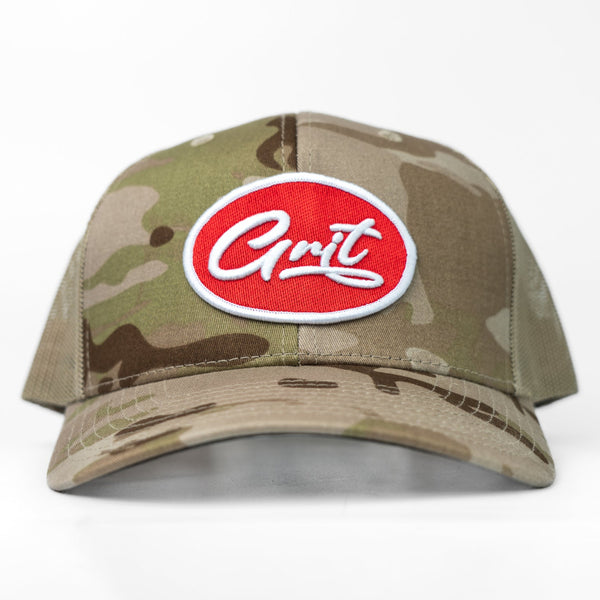 Camouflage baseball cap with a red and white logo on a white background
